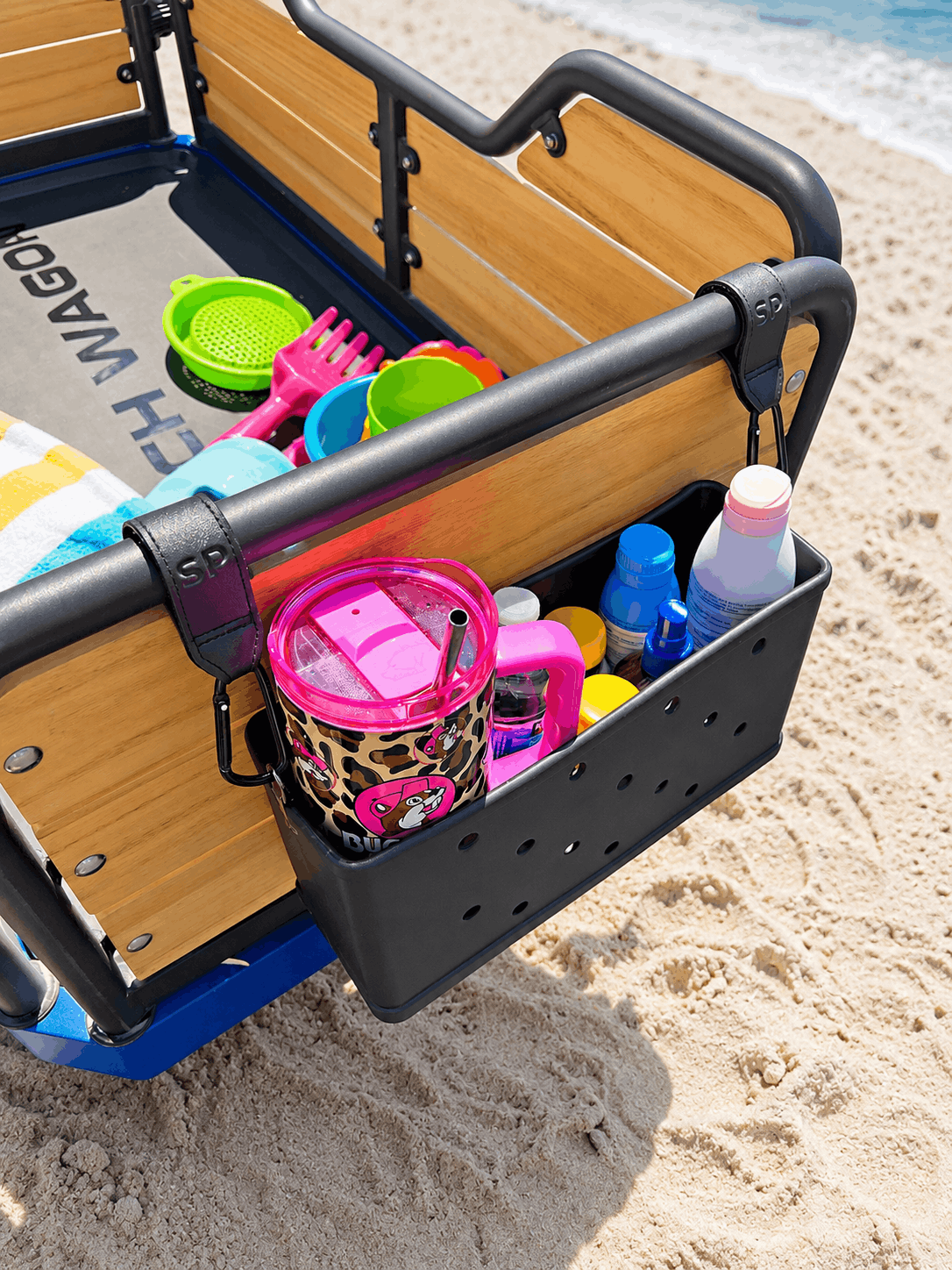 e-Beach Wagon's waterproof caddy holds sunscreen, wallets, phones, waterbottles, Stanley cups and more