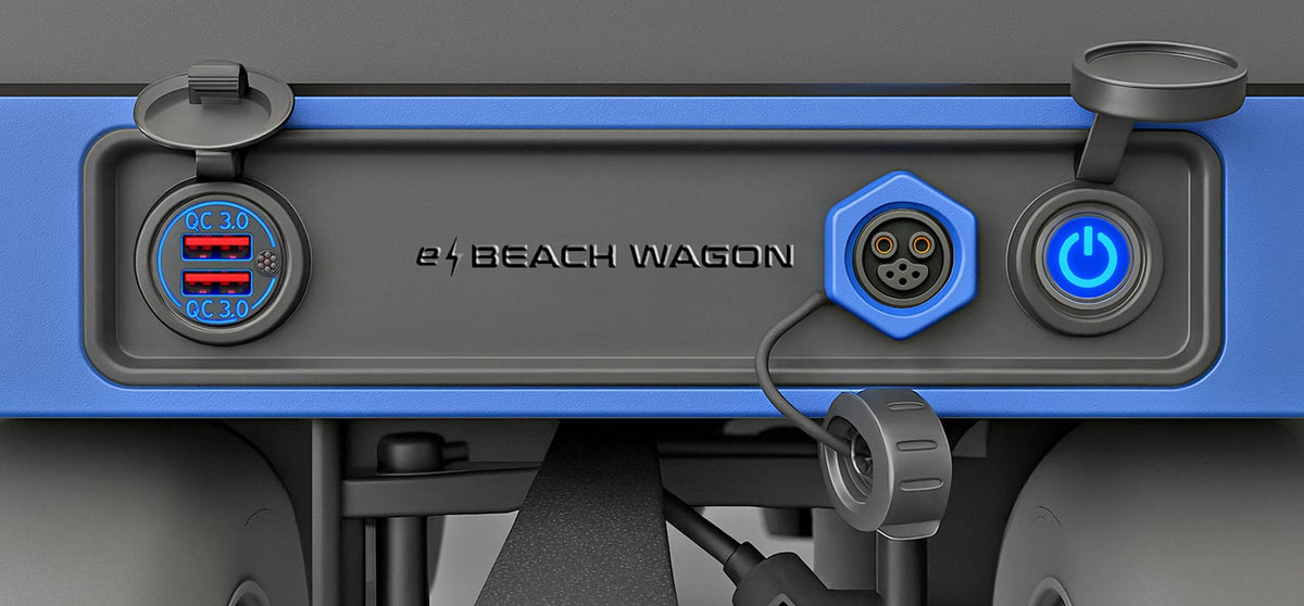 e-Beach Wagon&#39;s front control panel has two USB charging outlets, a lithium battery charger, and a power on/off switch, all protected by weatherproof covers