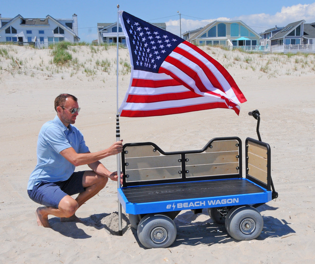 e-Beach Wagon has built-in holders for mounting umbrellas and flags