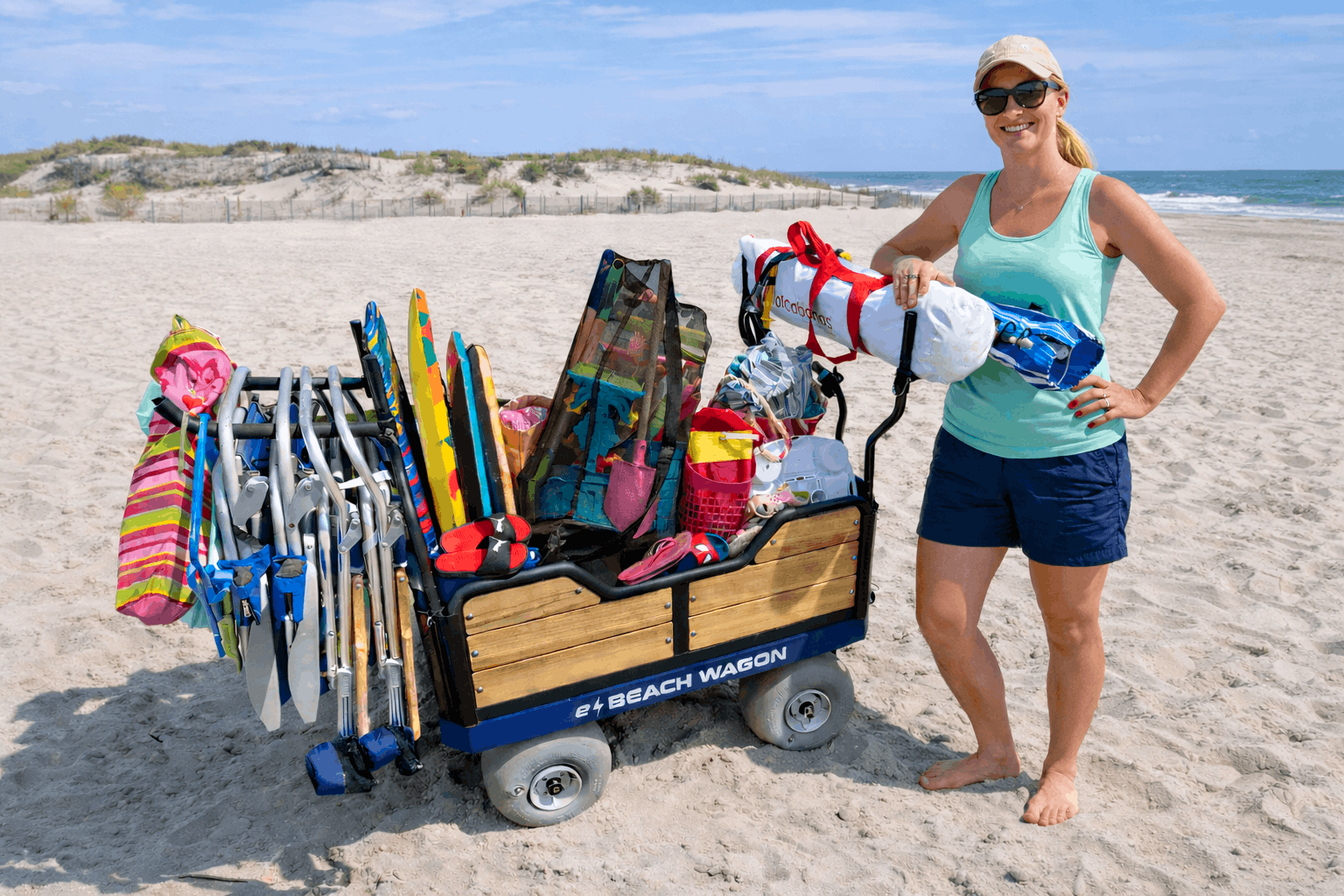 Woman standing by e-Beach Wagon in Avalon, New Jersey