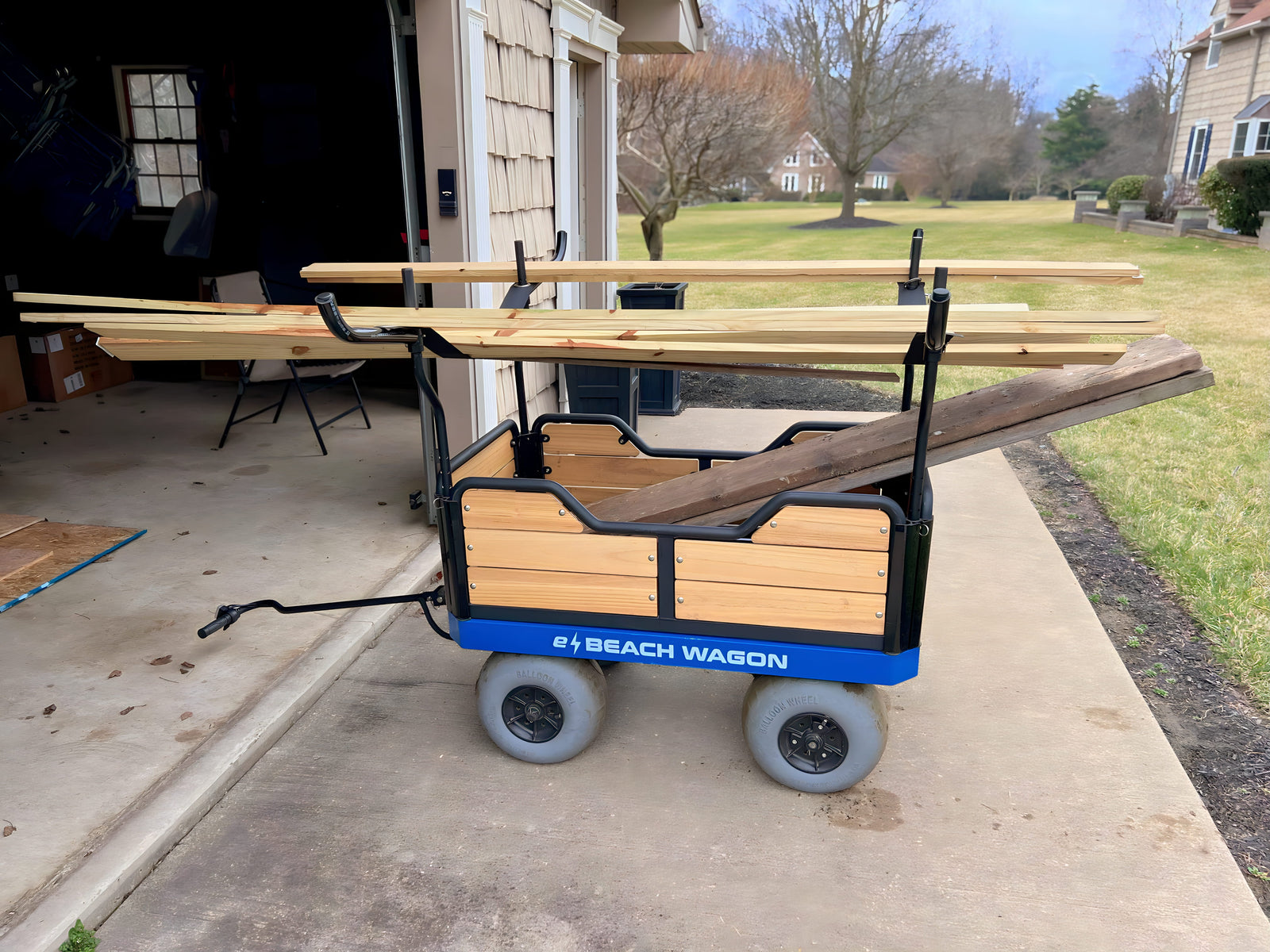 e-Beach wagon filled with wooden planks on a driveway