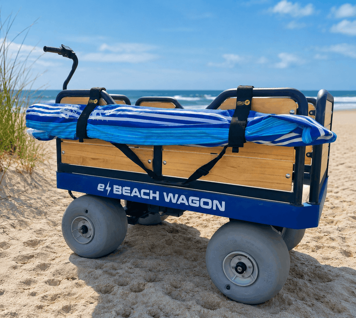 e-Beach Wagon with a blue and white striped beach umbrella strapped with a Wrap-It Twin-Wrap